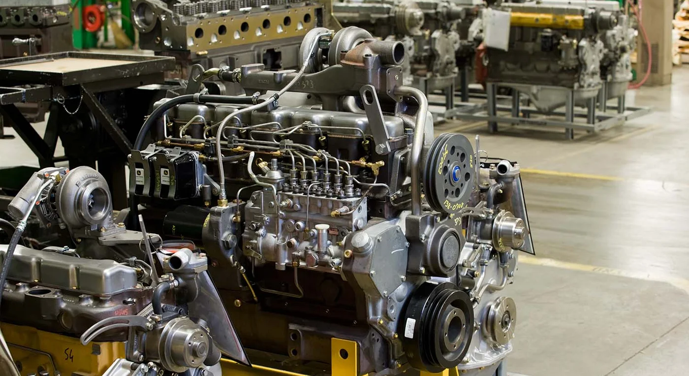 A John Deere Reman engine getting remanufactured in a factory